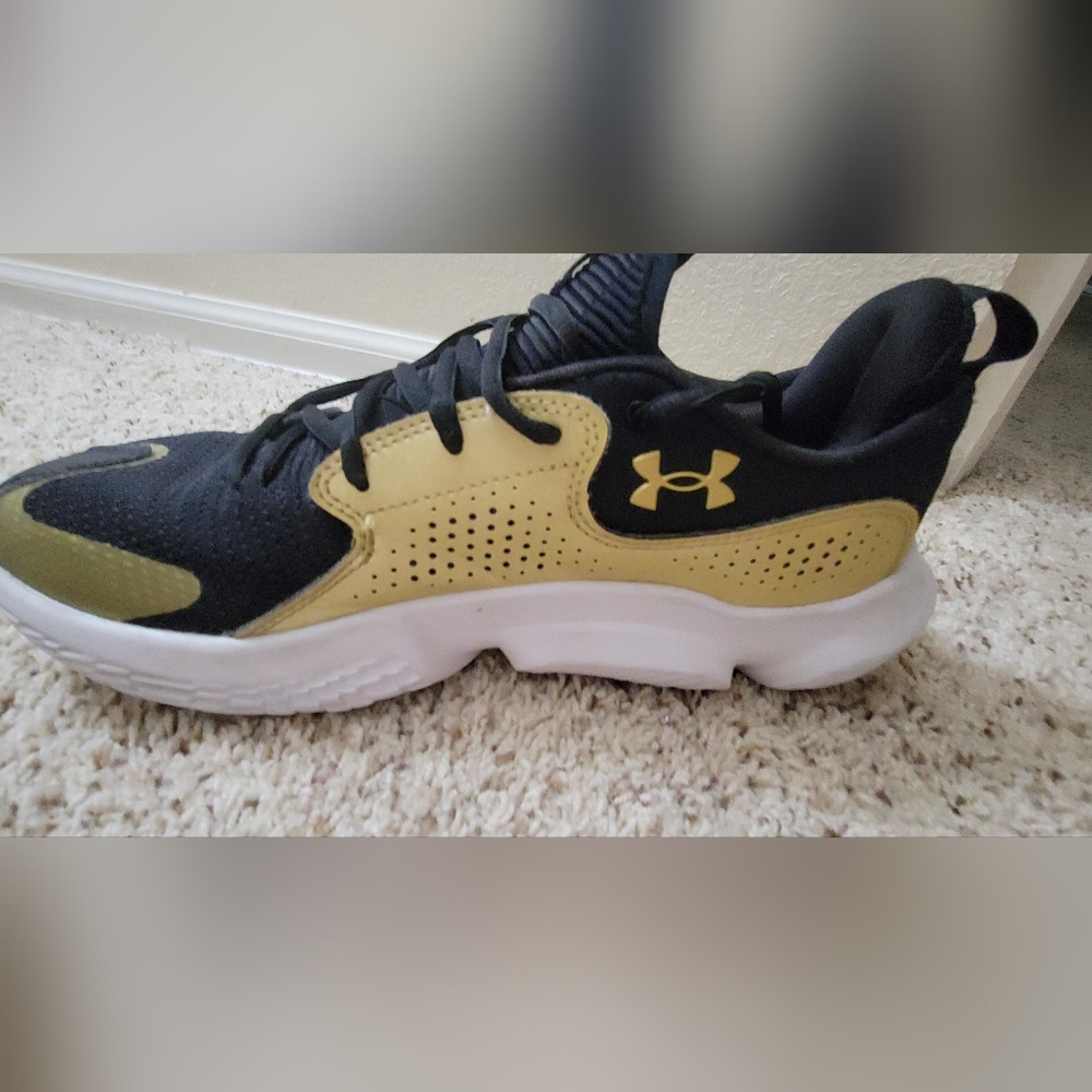 Under Armour Black and Gold Athletic Shoes with Sleek Design